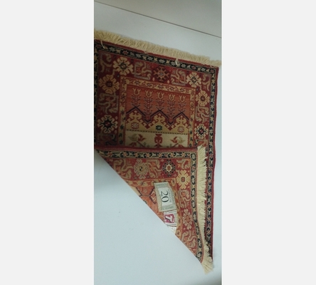 (12) Tapis oriental teinte orange et crème. 90/62 cm