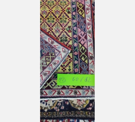 (12) Tapis oriental teintes rose et beige 60/82 cm.