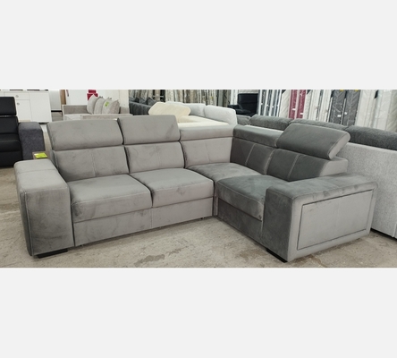 2A1KVG Canapé d'angle Karola convertible en velour gris, têtières amovibles.