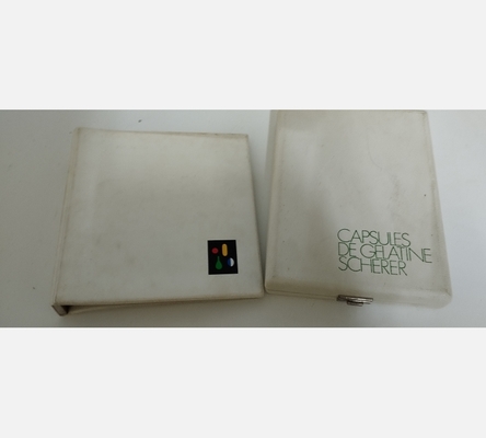 Coffret et fascicule de présentation de capsules vides Scherer