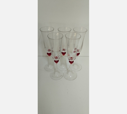 Lot de 5 coupes à Champagne, pied boule rouge.