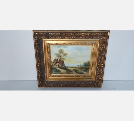 Peinture chaumière au bord du chemin dans joli cadre.