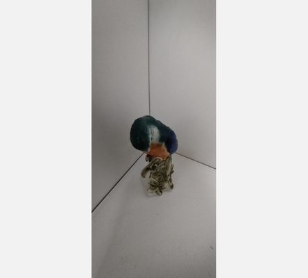 Peroquet en porcelaine