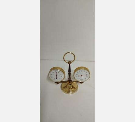 Thermomètre et hygromètre en laiton doré.